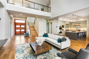 Modern open floor plan with hardwood flooring staircase and kitchen island in a Lexington Kentucky home interior