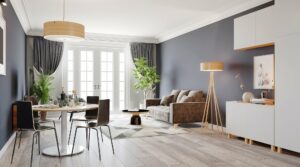Modern dining and living room with light wood look flooring and geometric area rug in an open concept home