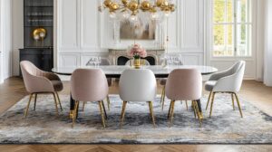 Luxury dining room with large patterned area rug under dining table creating style comfort and floor protection
